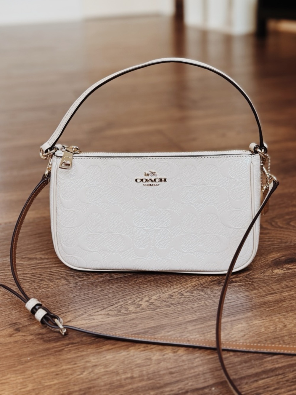 Coach Top Handle Glossy Beige Pouch in Signature Debossed Patent Leather